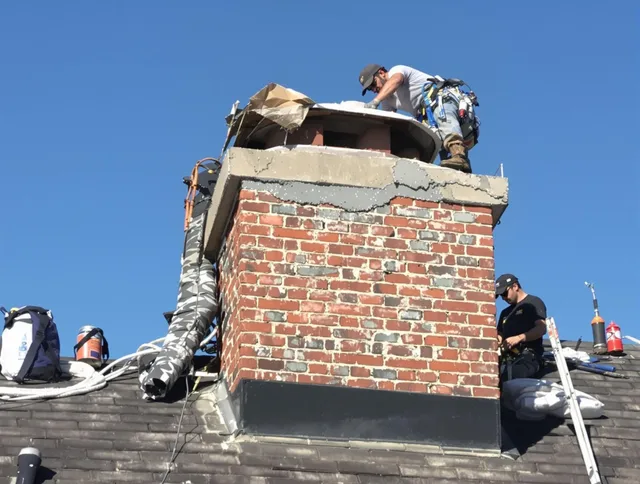 Mansfield Chimney Sweep installing a custom chimney crown in Mansfield, CT