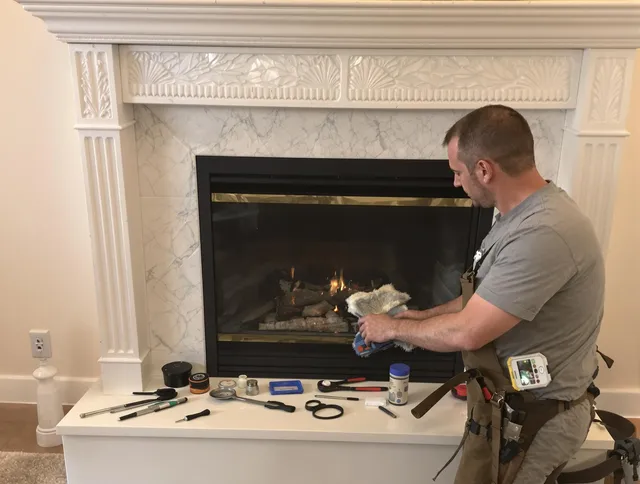 Mansfield Chimney Sweep performing fireplace maintenance in Mansfield, CT